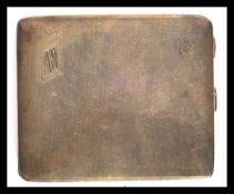 A silver hallmarked heavy cigarette case ( 138.4g ) with engine turned facia, monogram AW to