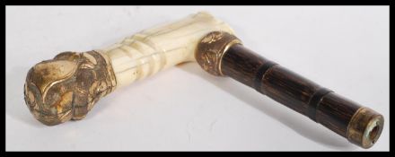 An early 20th century 14ct gold plated walking sti
