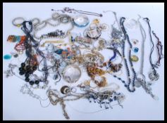 A collection of contemporary costume jewellery to include earrings , bracelets , necklaces.