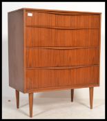 A 1970's retro vintage Austinsuite teak wood chest of drawers with a run of four drawers each with