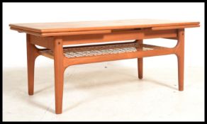 A retro 20th Century Danish inspired teak draw-lea