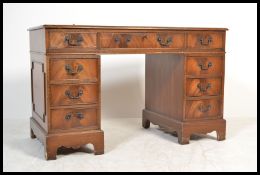 An antique style Georgian revival twin pedestal de