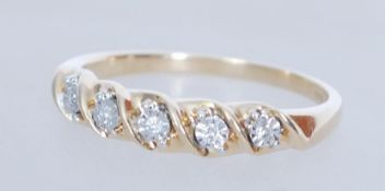 A hallmarked 9ct gold five stone diamond ring havi