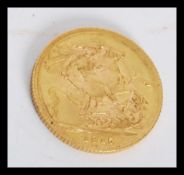 A George V 1915 full sovereign coin, St George & Dragon Obv.  Sovereign weighs 7.98 grams.