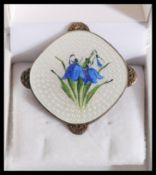 A vintage 20th century sterling silver Danish Guilloche enamel brooch  having a white enamel