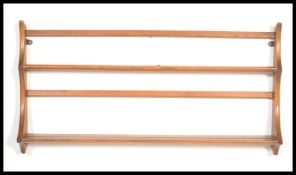 A 20th century beech and elm wood plate rack in th
