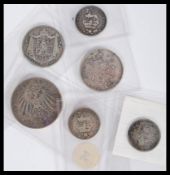 A collection of pre decimal silver coins dating from the early 19th century containing various