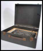 Two trays of vintage 20th century advertising printers blocks consisting of mostly logos and symbols