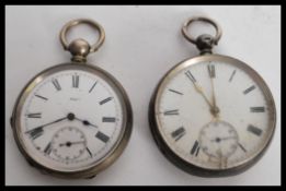 Two silver pocket watches to an example with white enamel face Roman numeral chapter ring and gilt