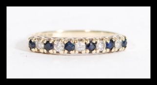 A hallmarked 9ct gold blue and white stone ring ha