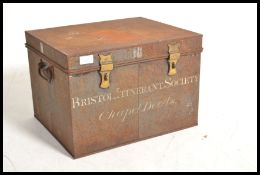 An unusual 19th century black metal deed box. Sqaure form with hinged top having notation for