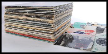 A collection of vinyl long play LP records and 7