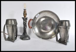 A Liberty Tudric planished pewter  twin handled dish being designed  by Archibald Knox. Stamped to