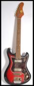 A vintage Teisco Top Twenty six string electric guitar having a shaped flame body. Measures 98.5