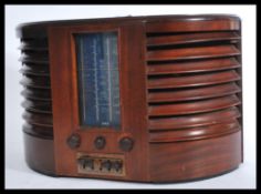 A vintage early 20th Century GEC large mahogany cased valve radio Model No BC4750 D shaped case with