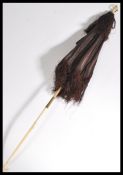 A Victorian 19th century fringed silk lady's carriage parasol with ivory and bone folding handle,