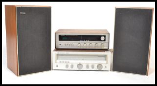A vintage Rotel Solid State teak cased AM / FM Stereo Receiver RX - 200A together with  a teak cased
