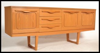 A retro Danish inspired 20th Century teak wood ven
