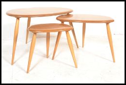A vintage / retro set of Ercol light  beech and elm retro pebble nest of tables, shape 354. Each