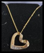 A hallmarked 9ct gold and diamond pendant necklace