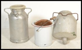 A vintage retro 20th century enamel bucket along with a vintage steel milk dairy bucket and churn.