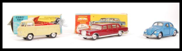 A group of 2x original vintage boxed Corgi diecast scale model cars to include a Volkswagen