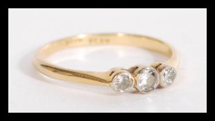 An 18ct gold and platinum three stone diamond ring having approx 20pnts of diamonds. Weighs 1.9