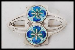 An early 20th century large silver hallmarked brooch in the manner of Archibald Knox for Liberty and