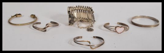 A group of vintage sterling silver bangles along w