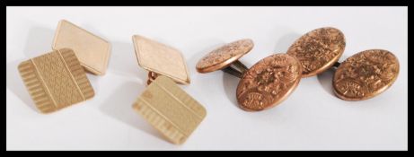 A pair of hallmarked 9ct gold cufflink cuff links of square form having engine turned panels