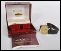 A vintage 20th century 9ct gold Rotary watch having a champagne dial with baton numerals and faceted