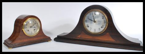 Two early 20th century mahogany cased Napoleons hat eight day mantel clocks. Both having silvered