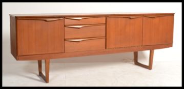 A 1970's retro teak wood sideboard credenza of Danish influence by Stonehill furniture being