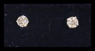 A pair of 14ct white gold diamond stud earrings of