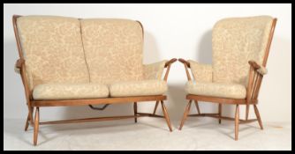 A vintage / retro 20th century Ercol Windsor two seater settee / sofa together with a matching