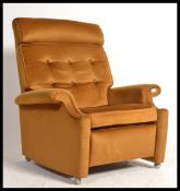 A vintage mid century Parker Knoll reclining armch