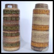 A pair of vintage retro 20th century West German ceramic fat lava style vases of tall form.