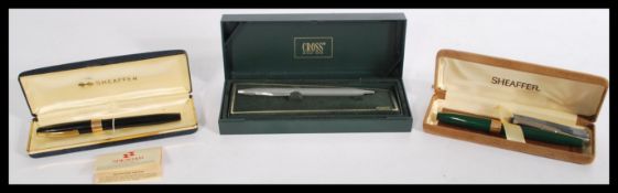Two boxed vintage Sheaffer 14k gold nib cartridge fountain pens both in original cases with