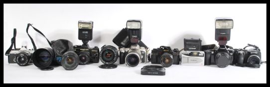 A group of vintage cameras and lenses to include P