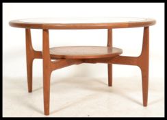A retro teak wood atomic 'Astro' circular coffee t