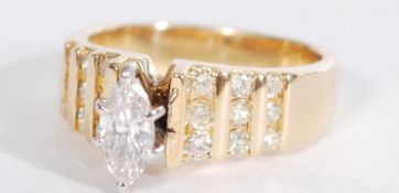 A 14ct yellow gold ring having a central marquise