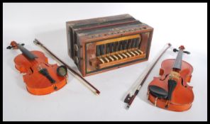Two vintage cased violin musical instruments by Skylark along with a vintage 20th century piano