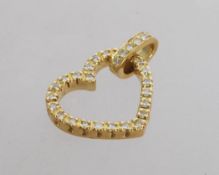 An 18ct gold and diamond pendant in the form of a