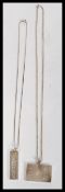 Two sterling silver hallmarked ingot pendants on silver necklace chains. Weighs 49.4 grams.