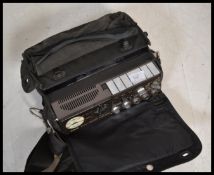 A vintage retro portable reporters reel to reel tape recorder by UHER model Heads 1426 in original