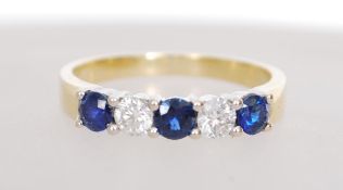 An 18ct gold diamond and sapphire ring having appr