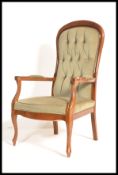 A Victorian style mahogany show wood salon armchai