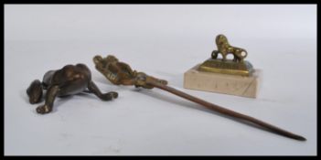 An early 20th century novelty bronze desk top vest