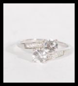 A hallmarked 10ct white gold and white stone cross