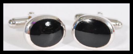 A pair of sterling silver cufflinks cuff links hav